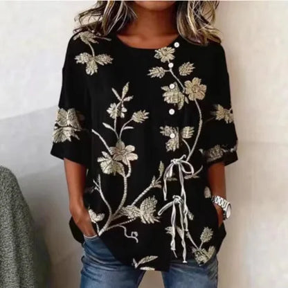Flor | Blusa con bordado floral en relieve y lazada lateral