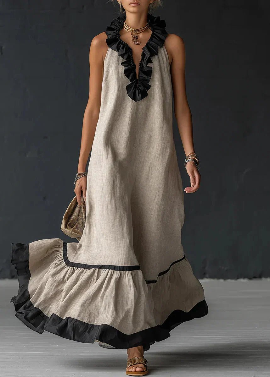 Vestido largo de mujer con volantes y cuello halter